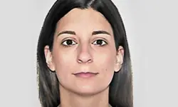 Portrait of a woman with dark hair.