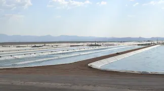 Solar farm with reflective panels in desert.