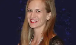 Smiling woman with long blonde hair.